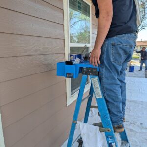 The P3Hpro strapped to a step ladder with a paint can, brushes and a ProWise sticker on the side pocket